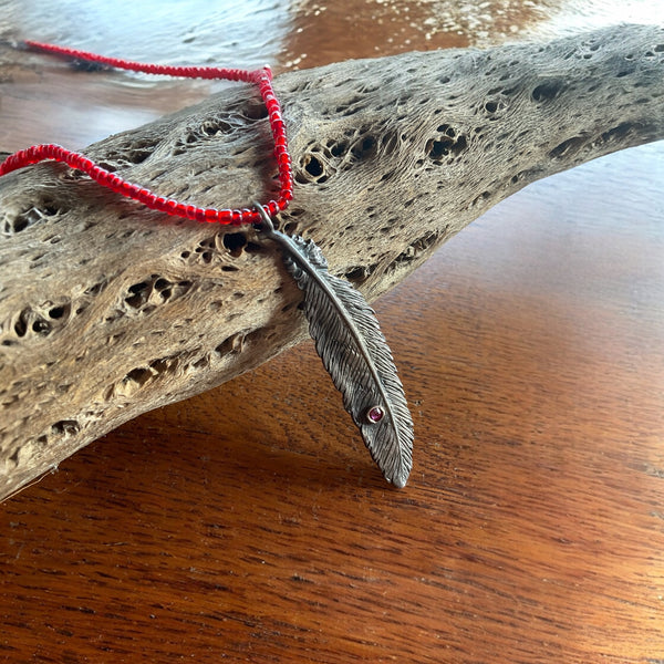 Silver Feather with Ruby stone set in 14k gold Necklace strung with vintage red glass beads and adjustable leather tie closure