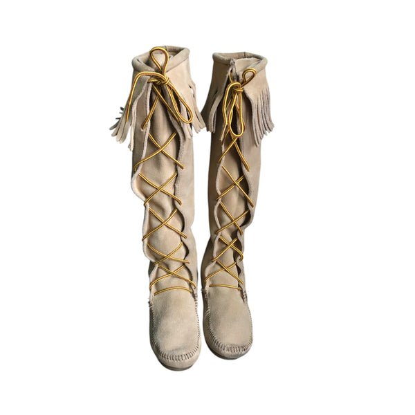 Minnetonka tall beige size 7 leather moccasins with lace front view with fringe boot