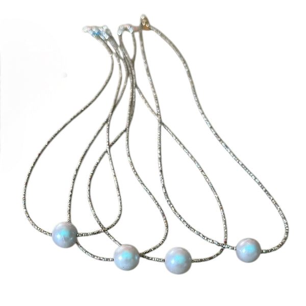 Round Pearl Necklace beaded with antique mixed micro seed beads with a lobster clasp closure.