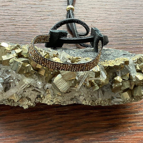 A Movie Star Bracelet Stormie Original Hand Beaded Design with Rare antique mixed metal seed beads custom hand finished with black leather and a Brass pony bead adjustable fits most sizes