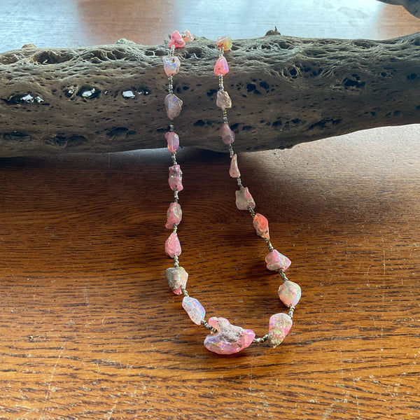 pink opal necklace on branch front view