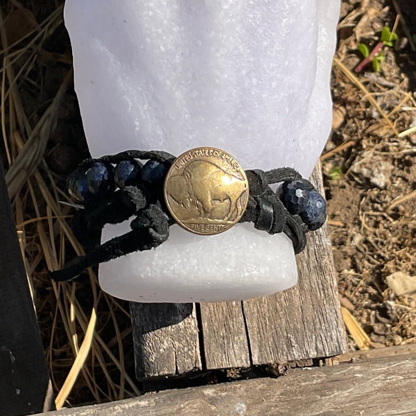 sapphire beaded bracelet on white hand mannequins