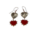Heart-shaped earrings with red and silver hearts on a white background