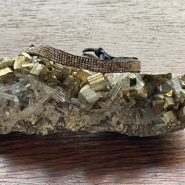 A Movie Star Bracelet Stormie Original Hand Beaded Design with Rare antique mixed metal seed beads custom hand finished with black leather and a Brass pony bead adjustable fits most sizes