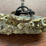 A Movie Star Bracelet Stormie Original Hand Beaded Design with Rare antique mixed metal seed beads custom hand finished with black leather and a Brass pony bead adjustable fits most sizes